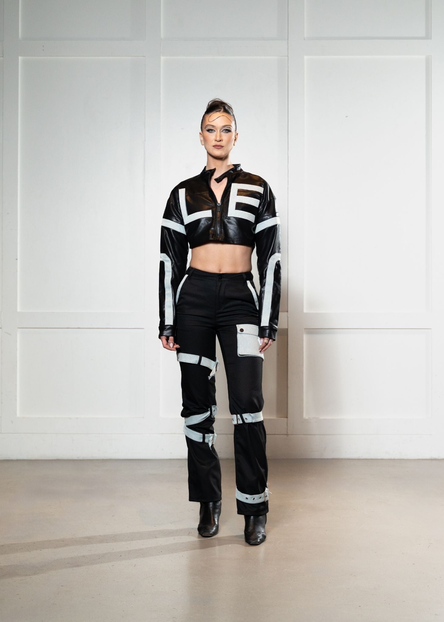 Laurenelle satin and vegan leather two-piece set front view. Chic and modern contrast design.