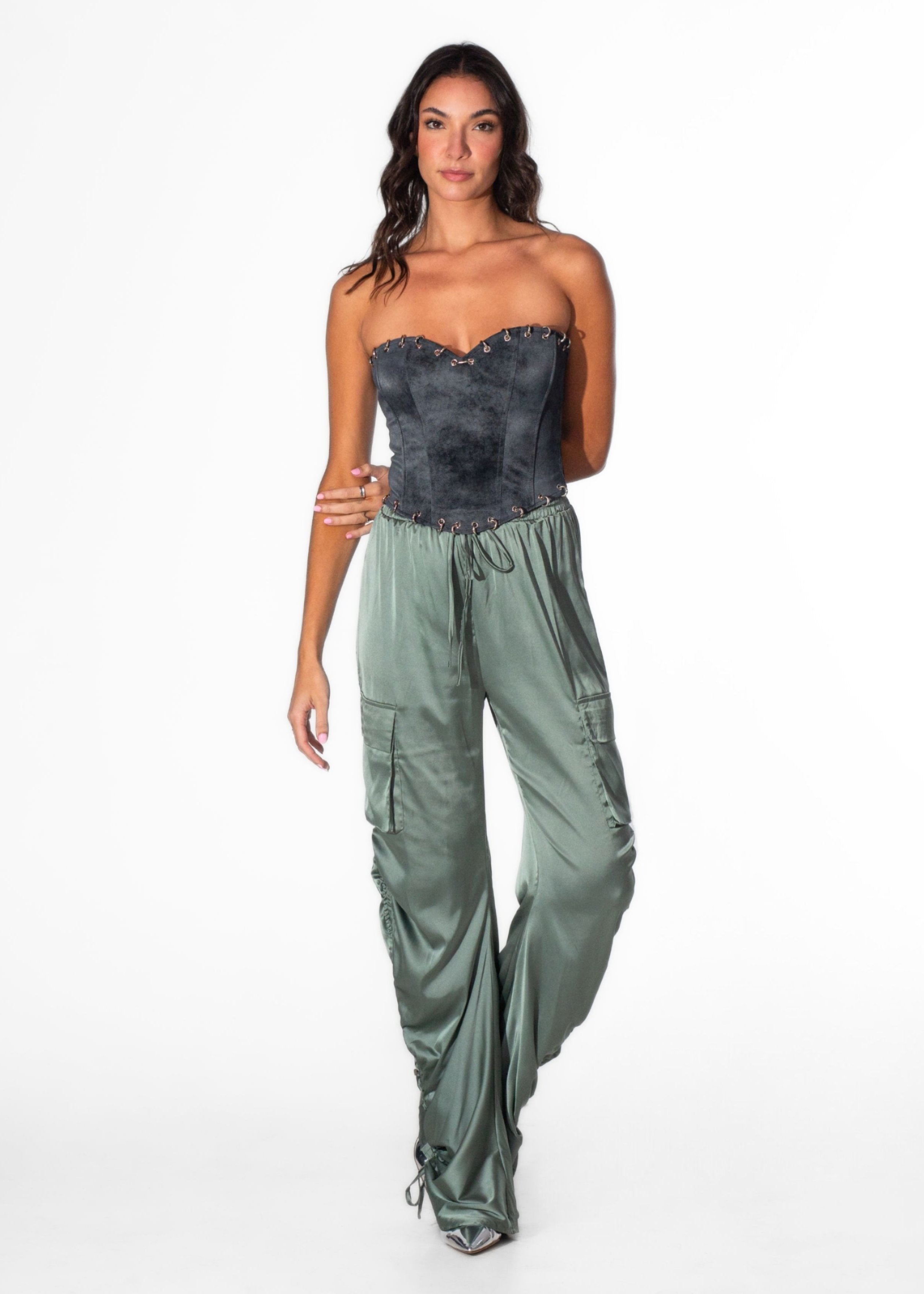 Front view of Laurenelle women’s black distressed pierced corset top featuring faux suede material and structured design.