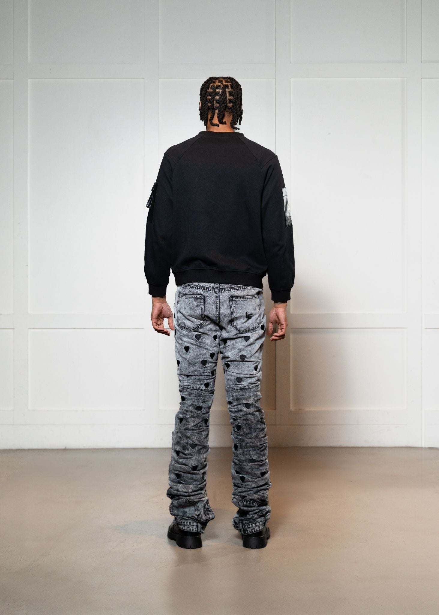 Laurenelle black vegan leather pocket sweatshirt back view. Stylish and contemporary casual wear.