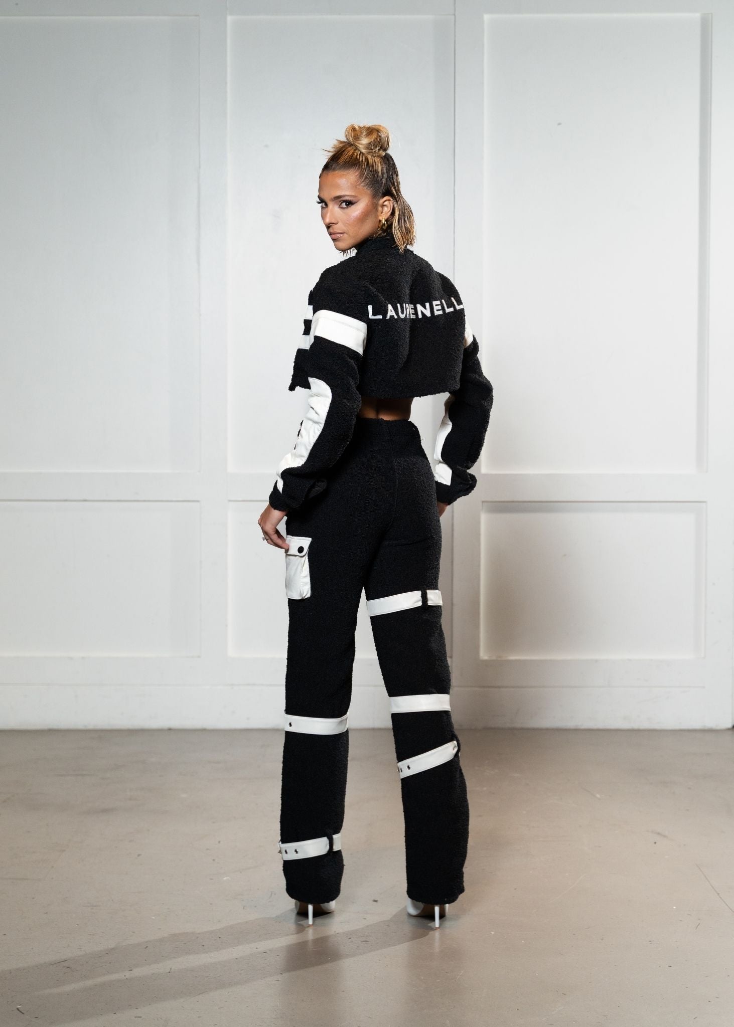 Laurenelle boucle and vegan leather set back view. Stylish and modern fashion ensemble.