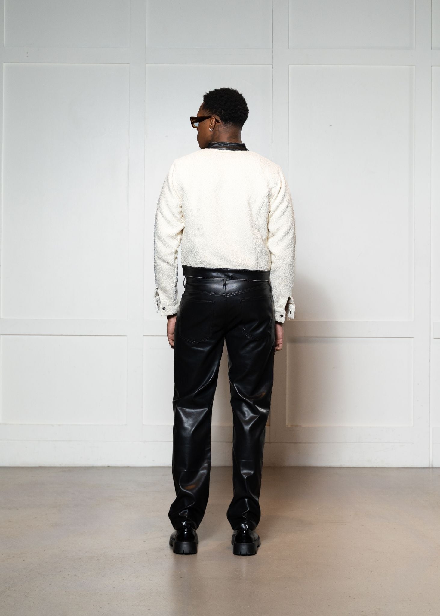 Laurenelle faux shearling jacket and vegan leather pant set back view. Stylish and sophisticated winter ensemble.