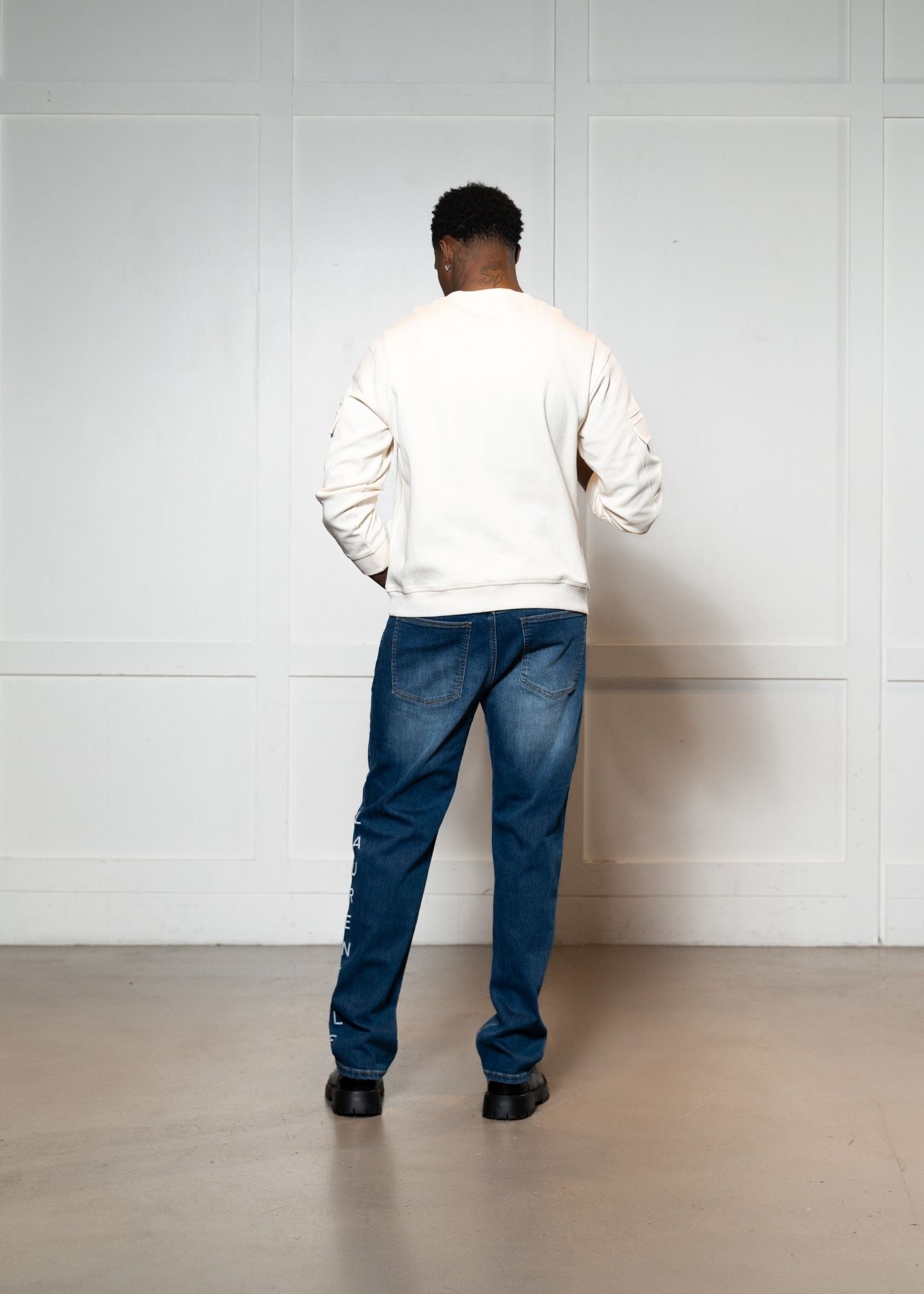 Laurenelle ivory vegan leather pocket sweatshirt back view. Sleek and contemporary casual style.