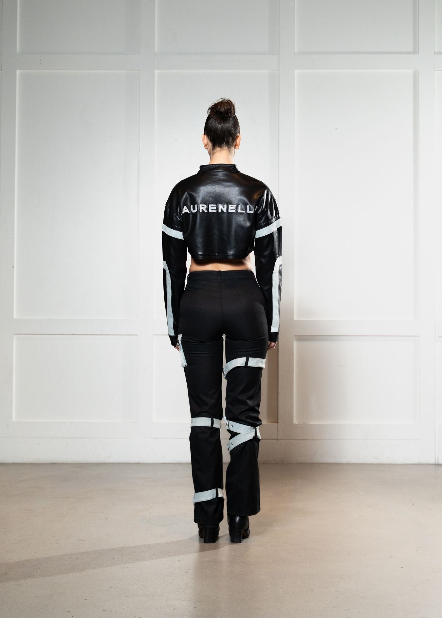 Laurenelle satin and vegan leather two-piece set back view. Stylish and elegant contrast design.