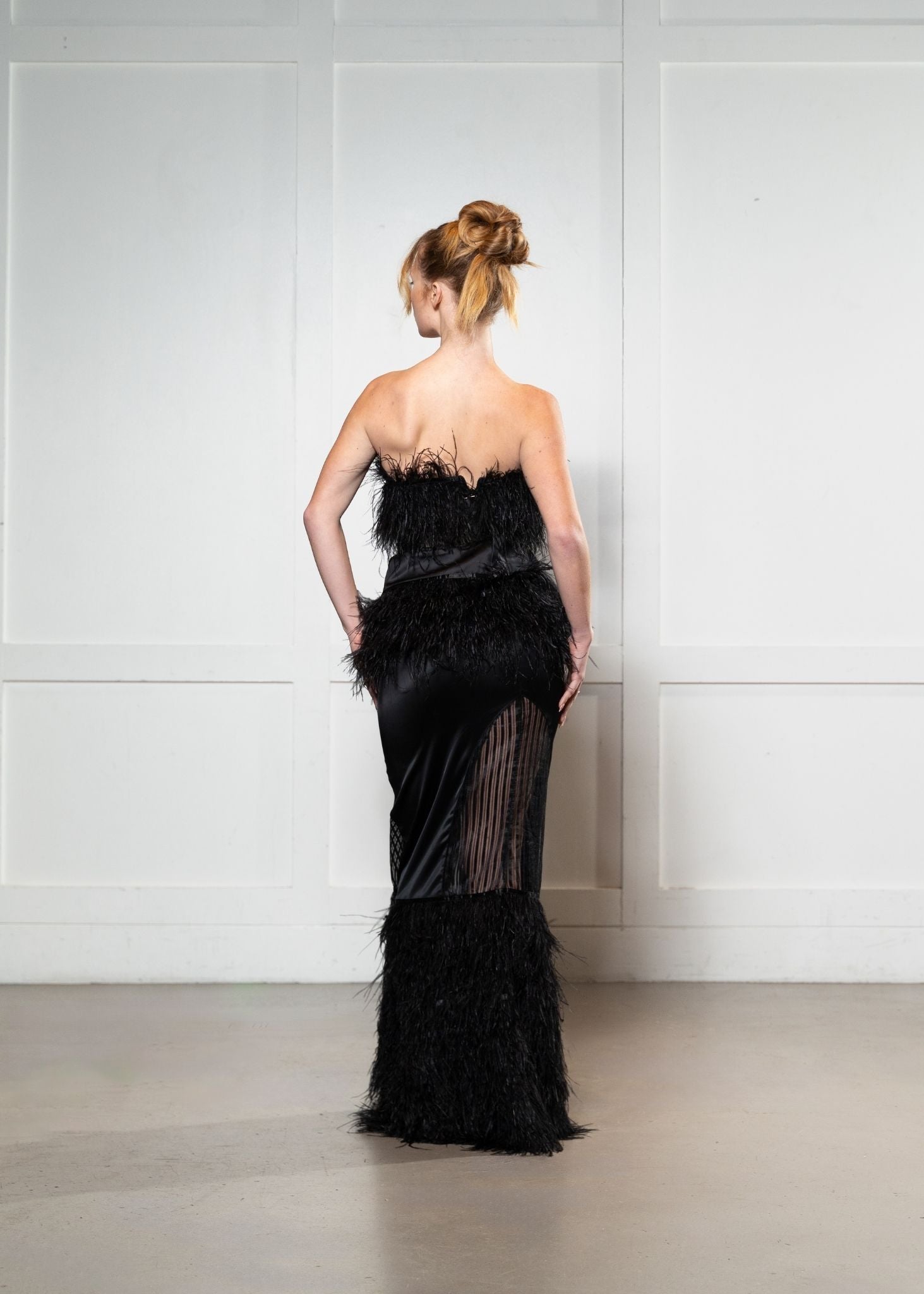 Laurenelle sheer ostrich feather gown back view. Glamorous and sophisticated evening wear.