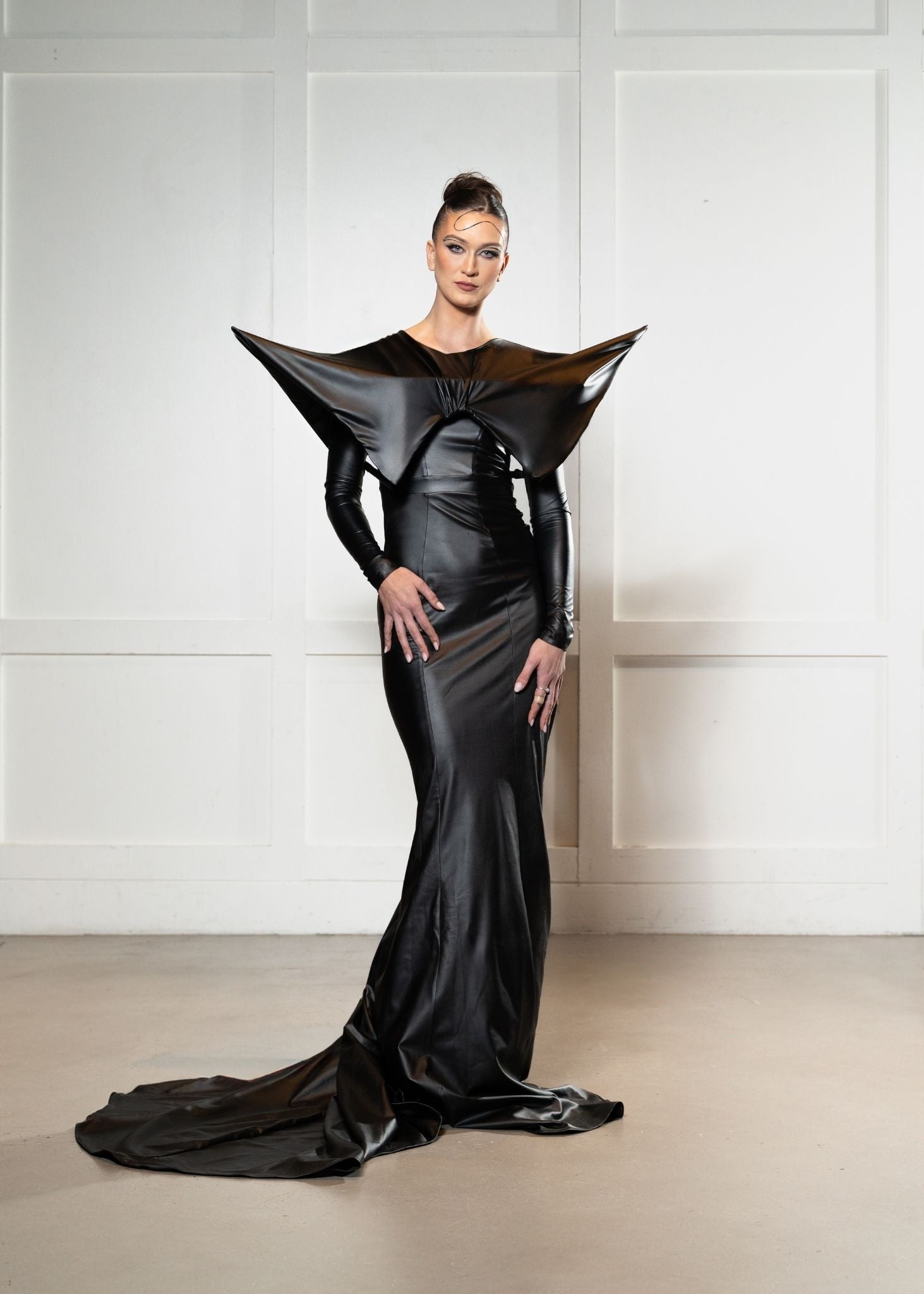 Laurenelle well-appointed leatherette statement dress front view. Bold and sophisticated fashion piece.