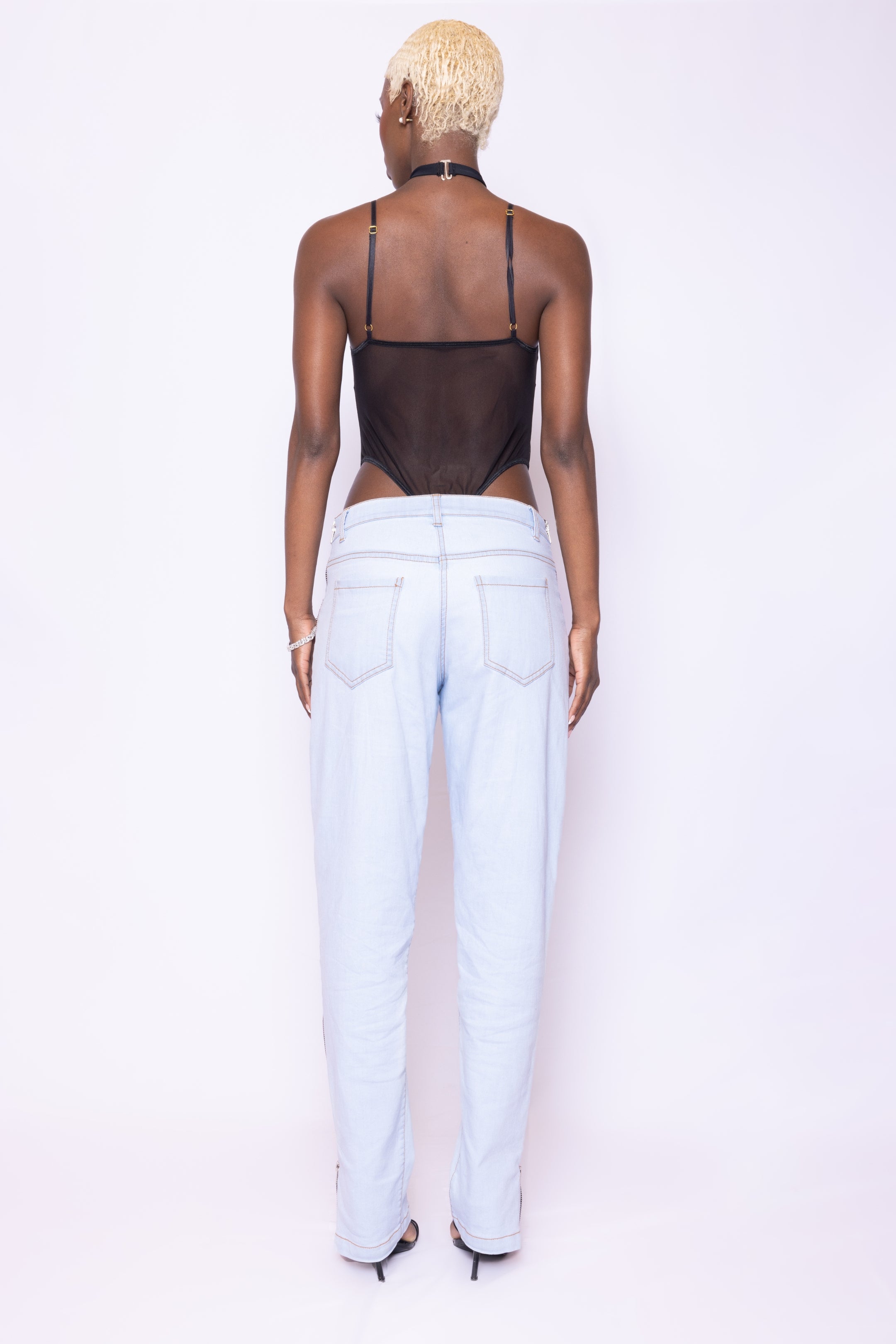 Back view of Laurenelle black mesh halter bodysuit showcasing its open-back design and breathable 4-way stretch mesh.