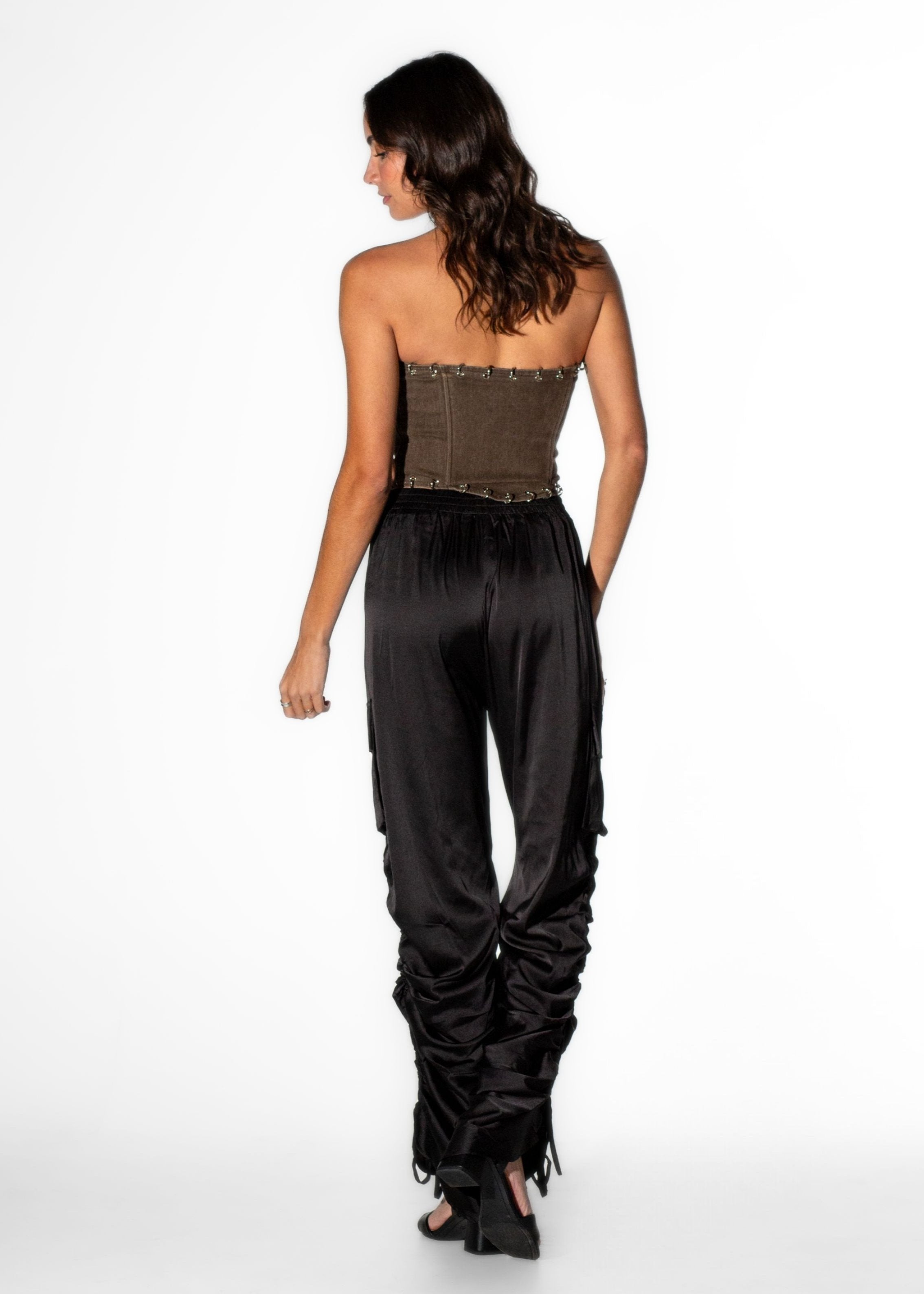 Back view of Laurenelle women’s brown pierced corset top highlighting pierced details and a fitted design.