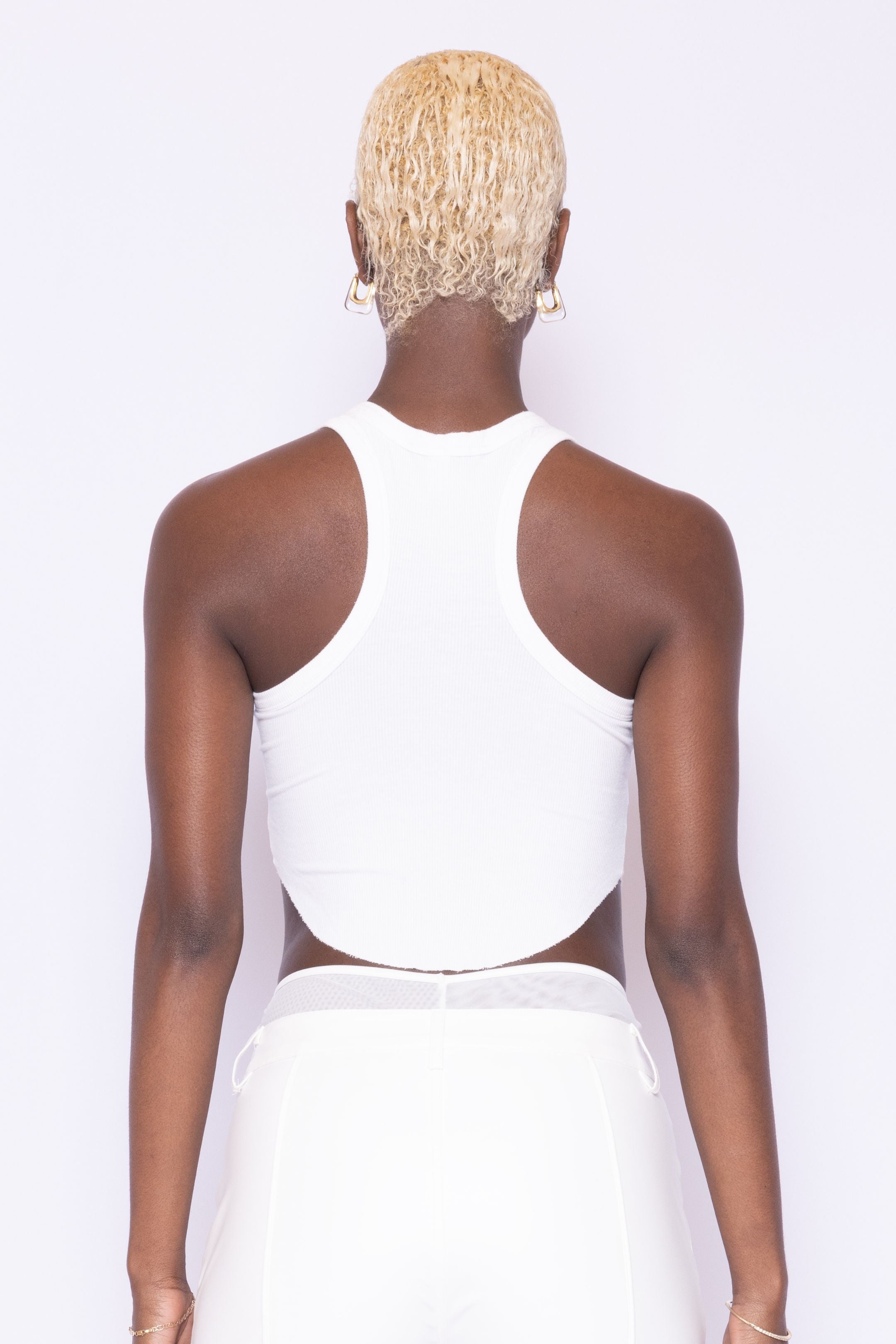 Cropped back view of Laurenelle women’s white crop racerback tank top showcasing the racerback design.